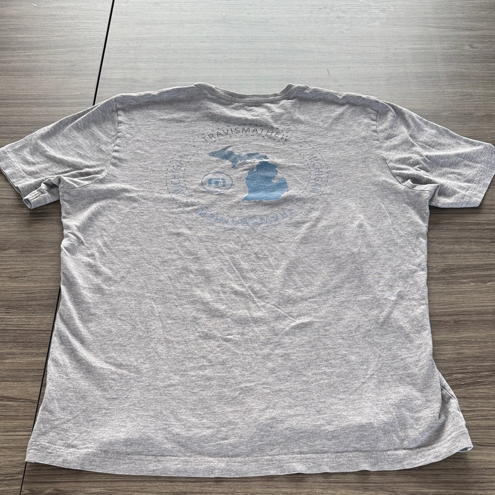 Travis Mathew Light Gray Tee with Blue Michigan Logo